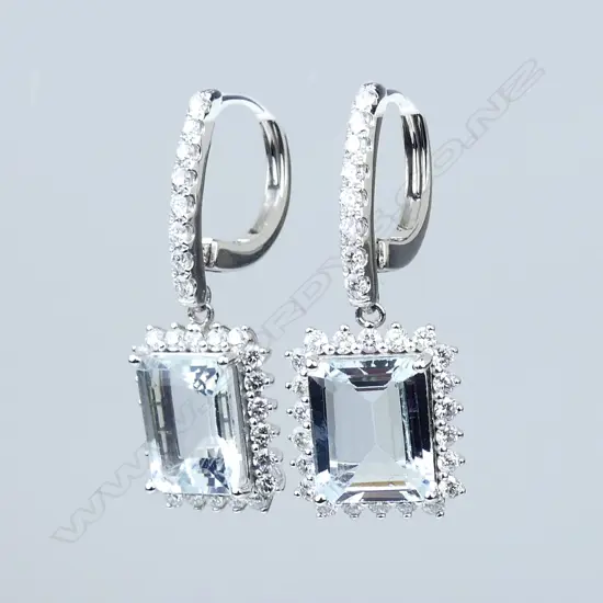 A pair of 14ct white gold aquamarine and diamond earrings