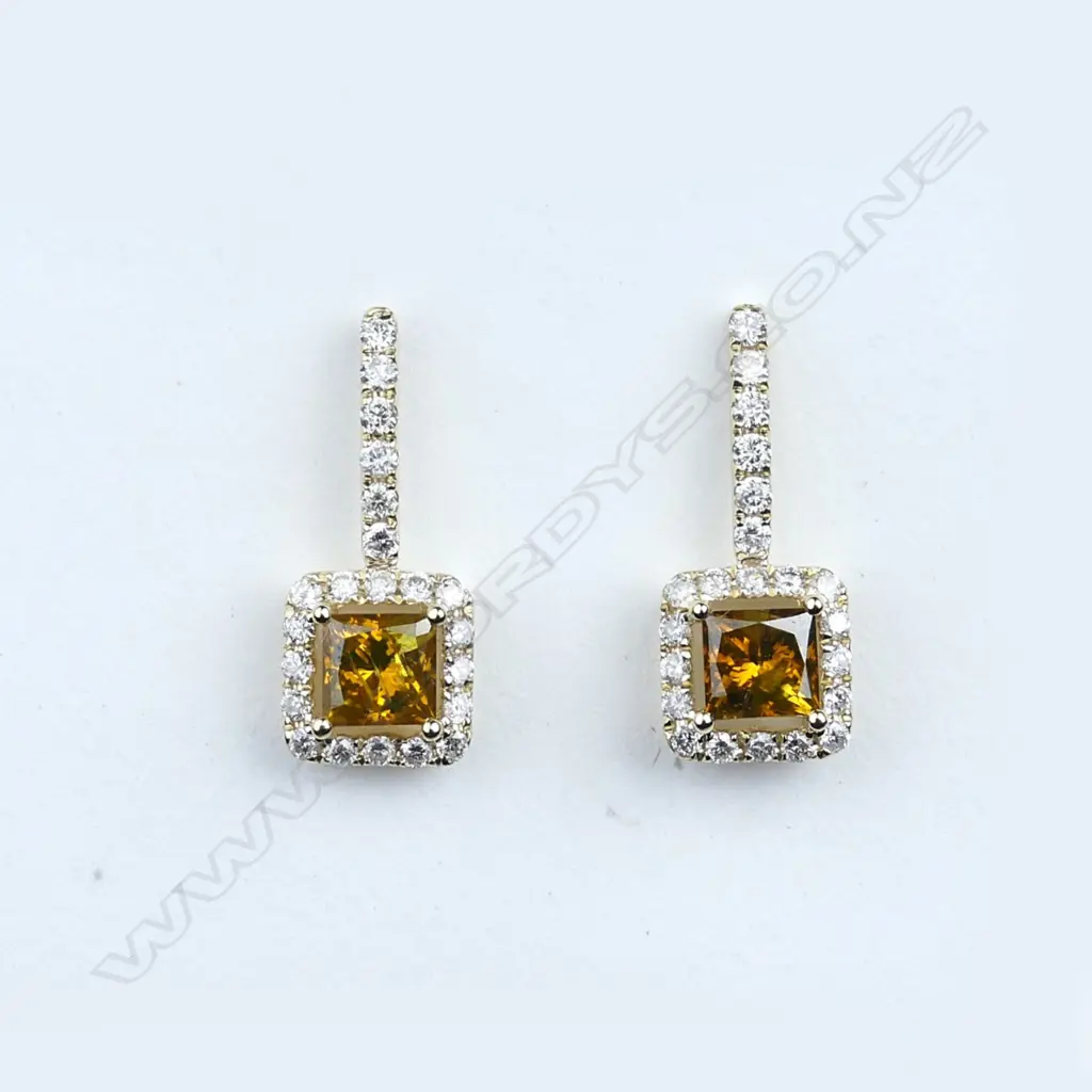 A pair of 14ct gold and diamond earrings Image 1++