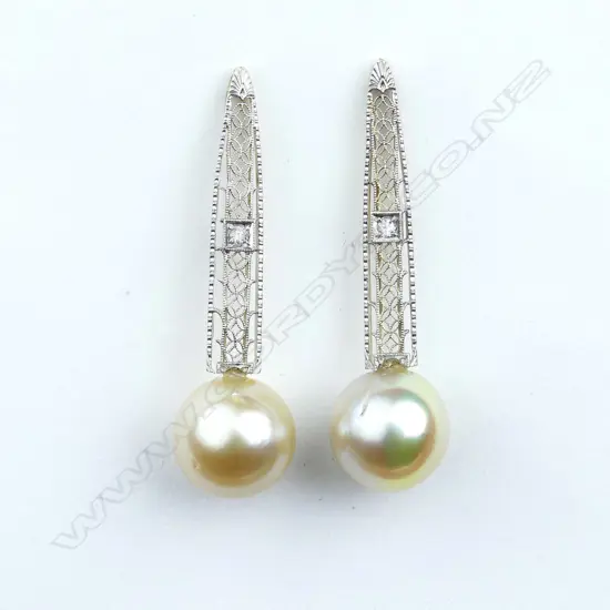 A pair of 14ct gold pearl and diamond drop earrings