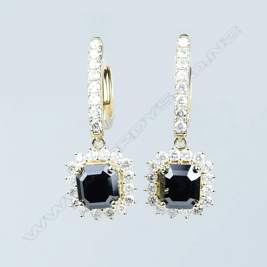 A pair of 14ct gold and diamond earrings Image 1++