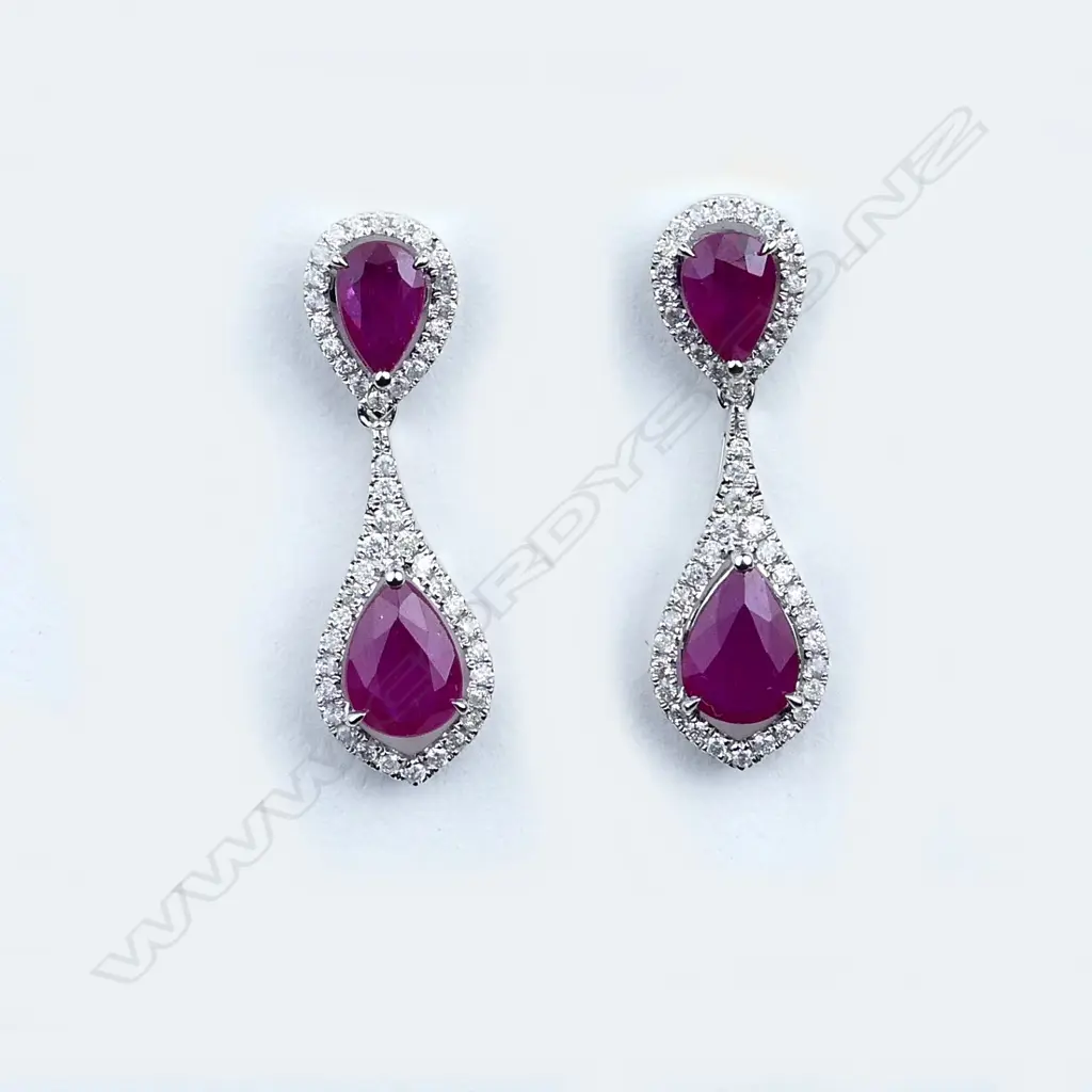 A pair of 14ct white gold ruby and diamond earrings Image 1++