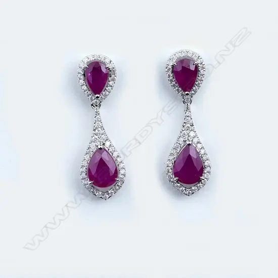A pair of 14ct white gold ruby and diamond earrings