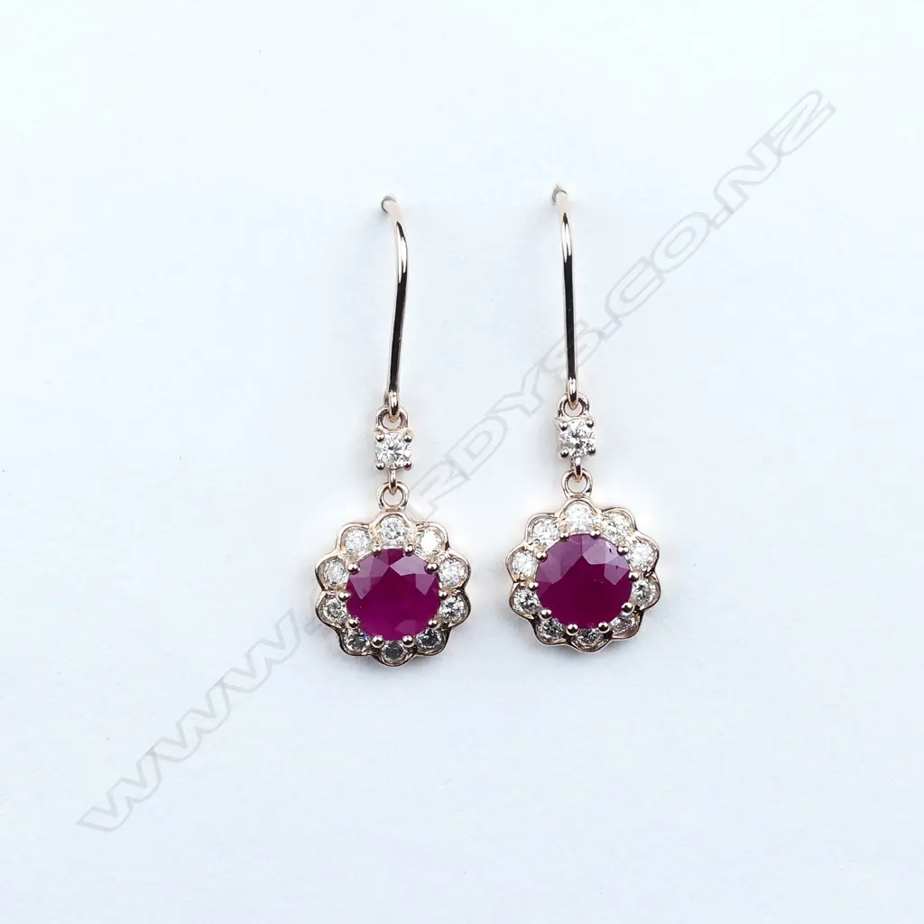 A pair of 14ct rose gold ruby and diamond earrings Image 1++