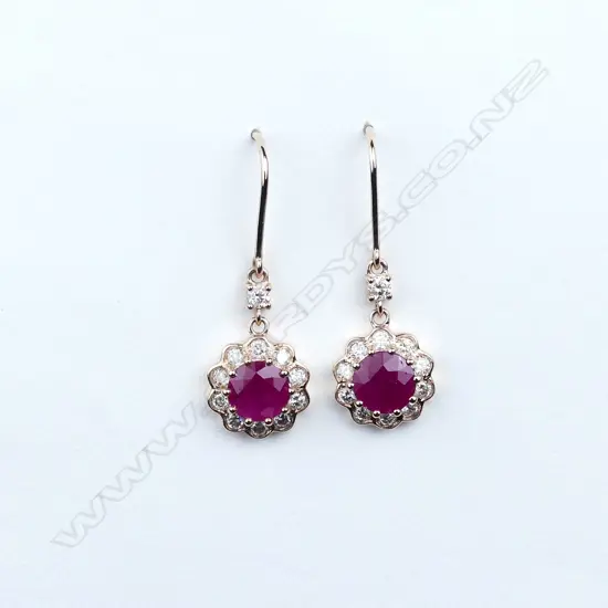 A pair of 14ct rose gold ruby and diamond earrings