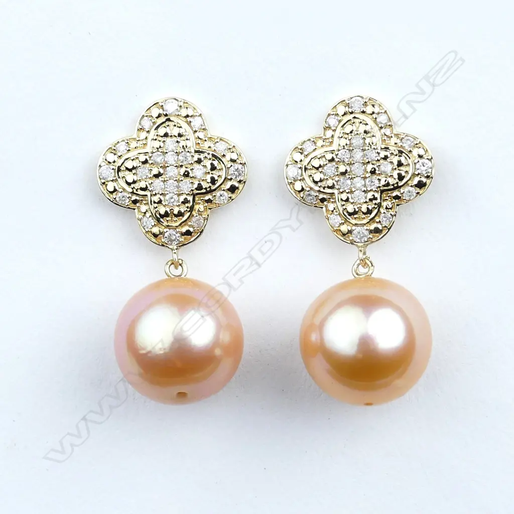A pair of 14ct gold pearl and diamond drop earrings Image 1++
