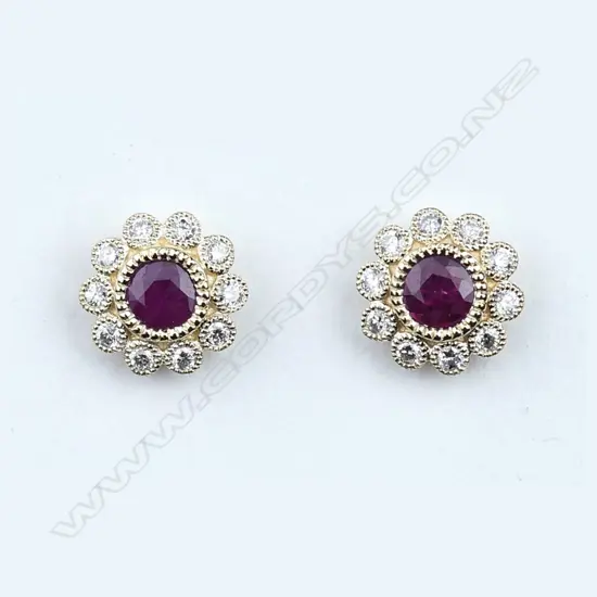 A pair of 14ct gold ruby and diamond stud earrings