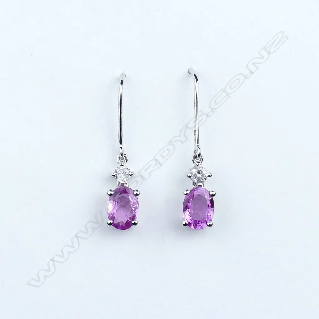 A pair of 14ct white gold sapphire and diamond drop earrings Image 1++