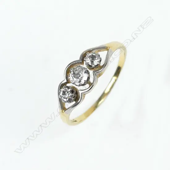An estate 18ct gold and three stone diamond ring