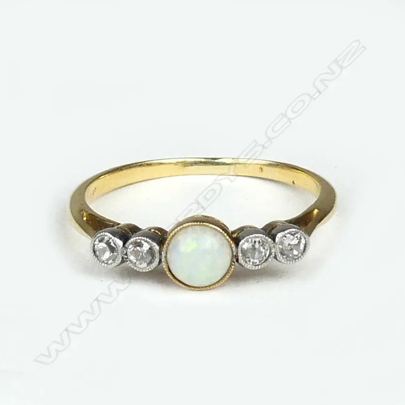 An estate 18ct gold opal and diamond ring Image 1++