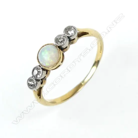 An estate 18ct gold opal and diamond ring