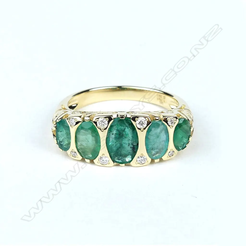A 14ct gold emerald and diamond ring Image 1++
