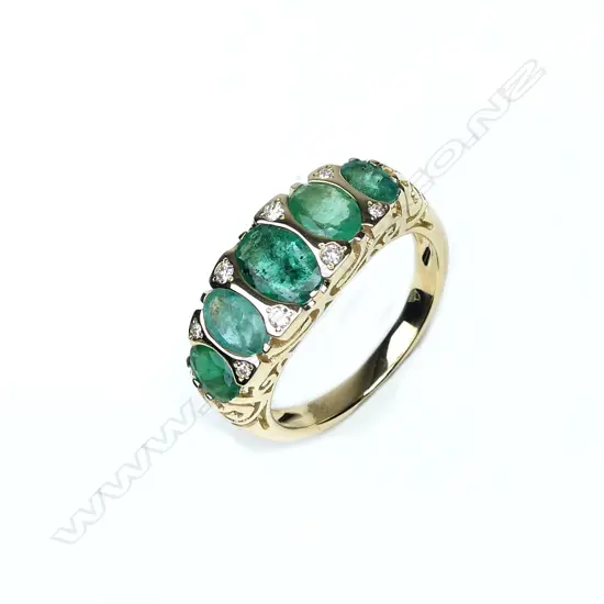 A 14ct gold emerald and diamond ring