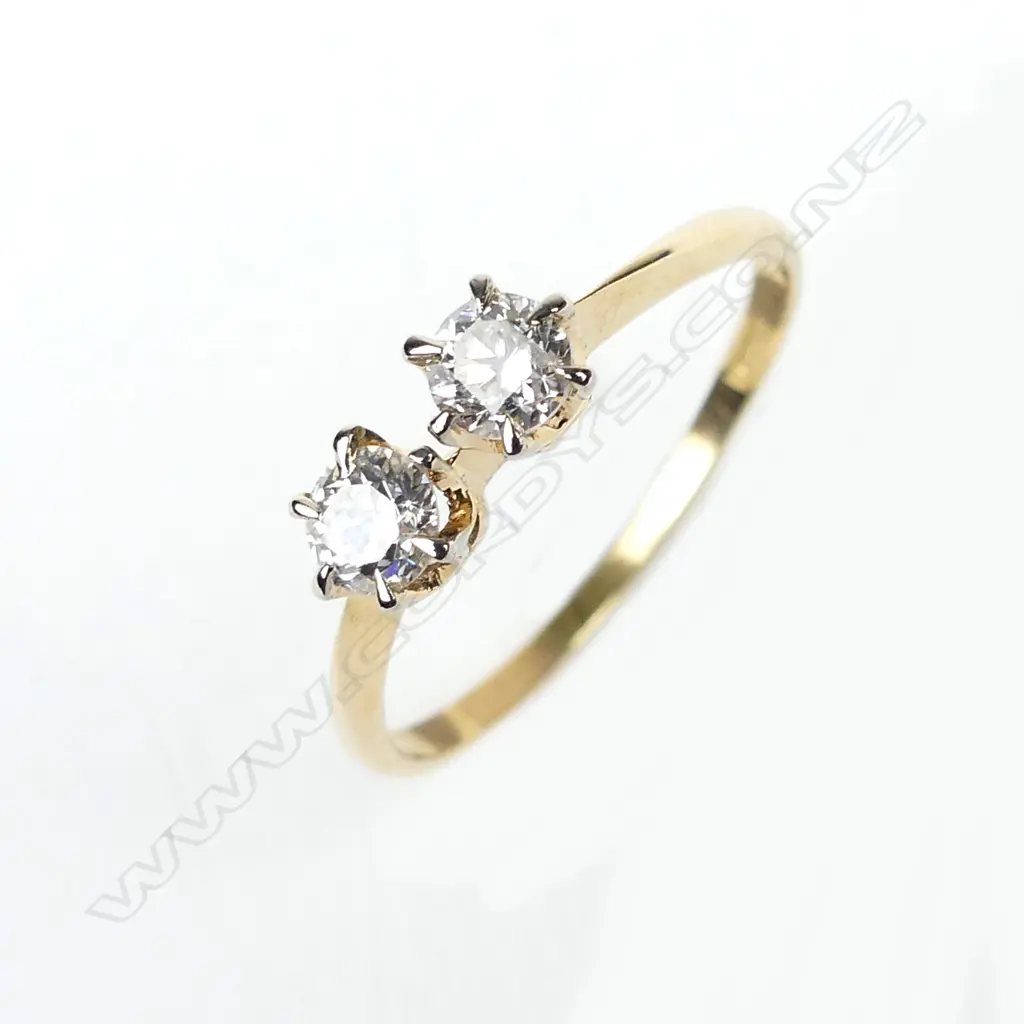An 18ct gold and two stone diamond ring Image 1++