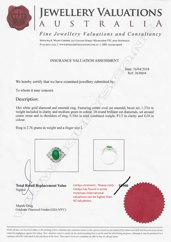 An 18ct white gold emerald and diamond ring Image 1++