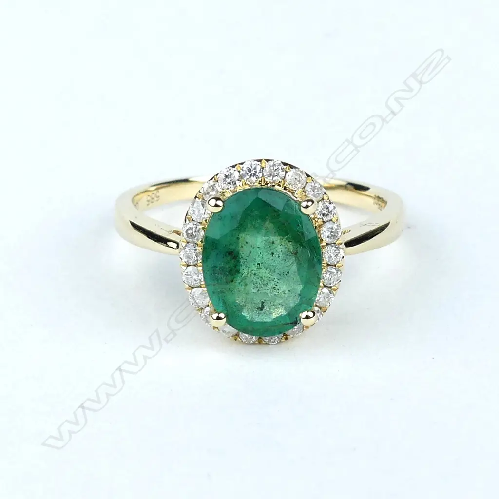 A 14ct gold emerald and diamond ring Image 1++