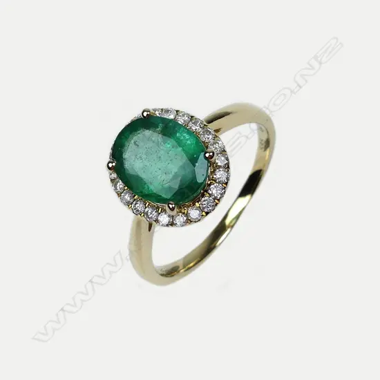 A 14ct gold emerald and diamond ring