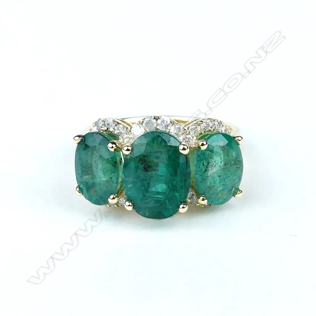 A 14ct gold emerald and diamond ring Image 1++