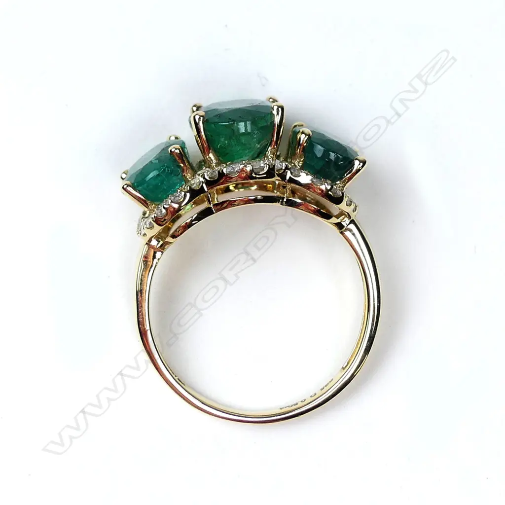 A 14ct gold emerald and diamond ring Image 1++