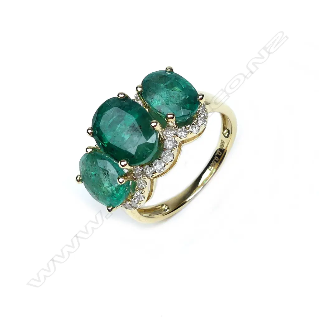 A 14ct gold emerald and diamond ring Image 1++