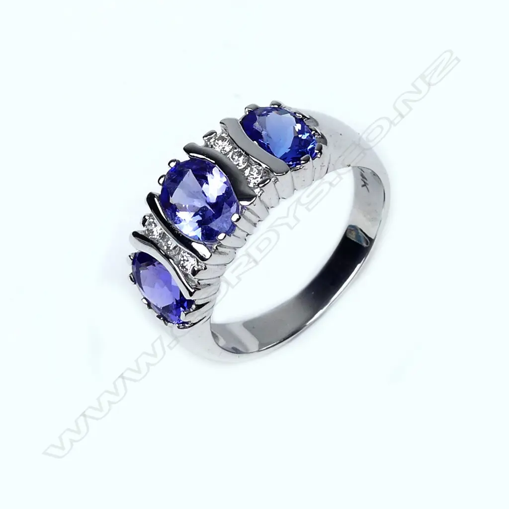 A 14ct white gold tanzanite and diamond ring Image 1++