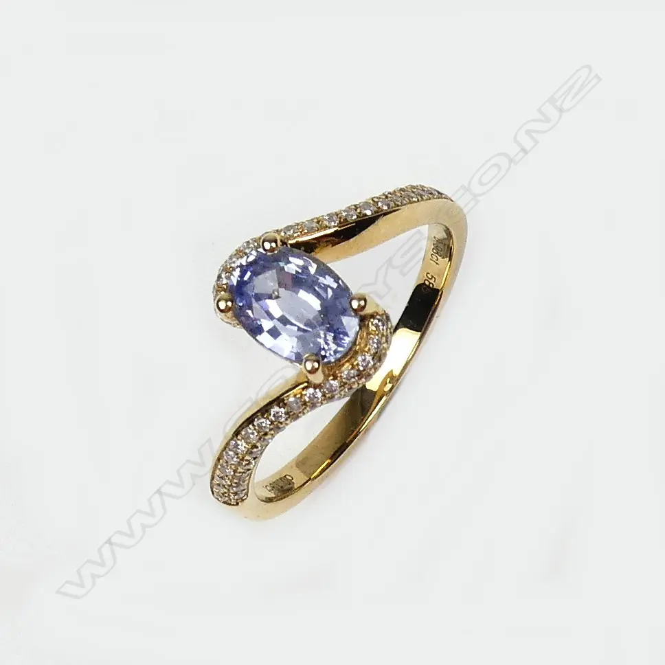 A 14ct gold sapphire and diamond ring Image 1++