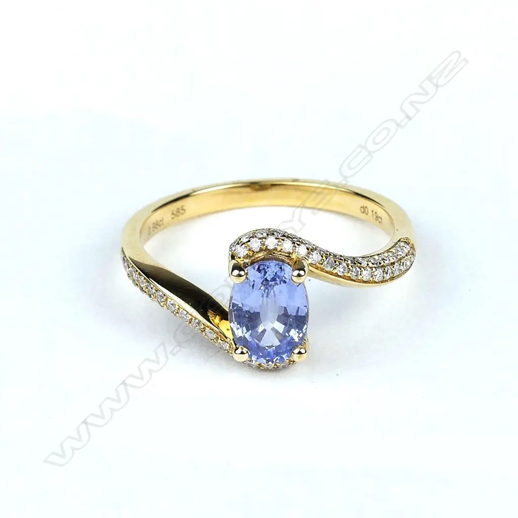 A 14ct gold sapphire and diamond ring Image 1++