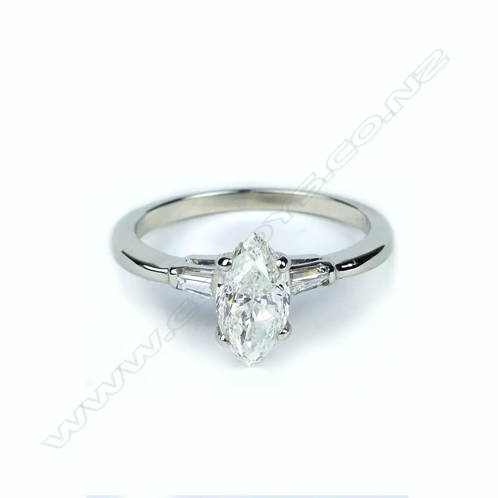 A 14ct white gold and diamond solitaire ring Image 1++