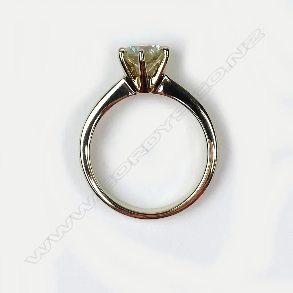 A 14ct gold diamond solitaire ring Image 1++