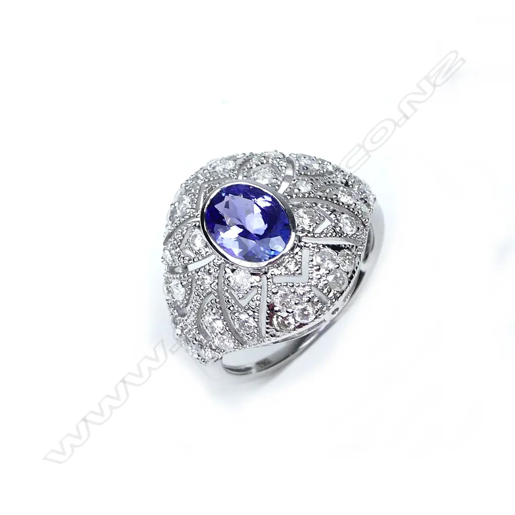 An 18ct white gold tanzanite and diamond Art Deco style ring Image 1++