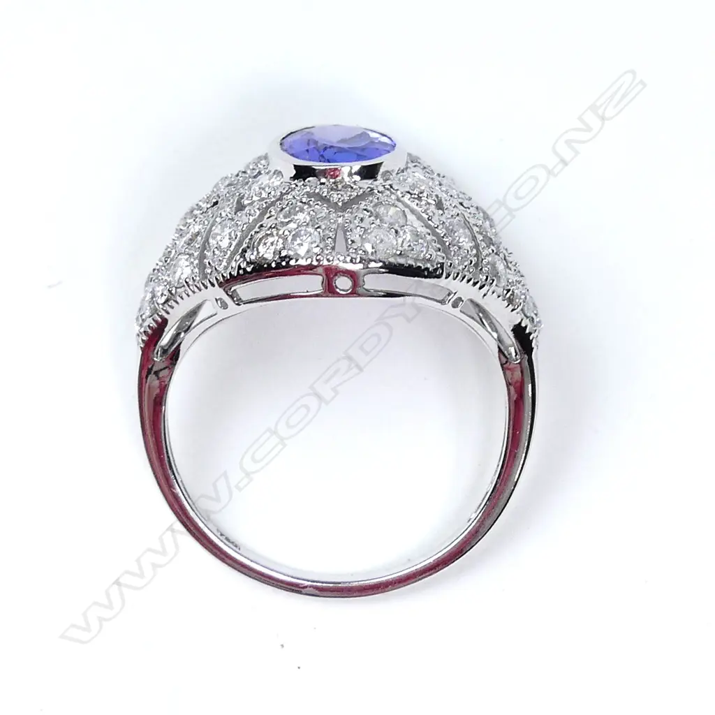 An 18ct white gold tanzanite and diamond Art Deco style ring Image 1++