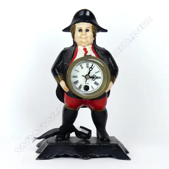 A German 19thC cast iron figural blinking eye clock