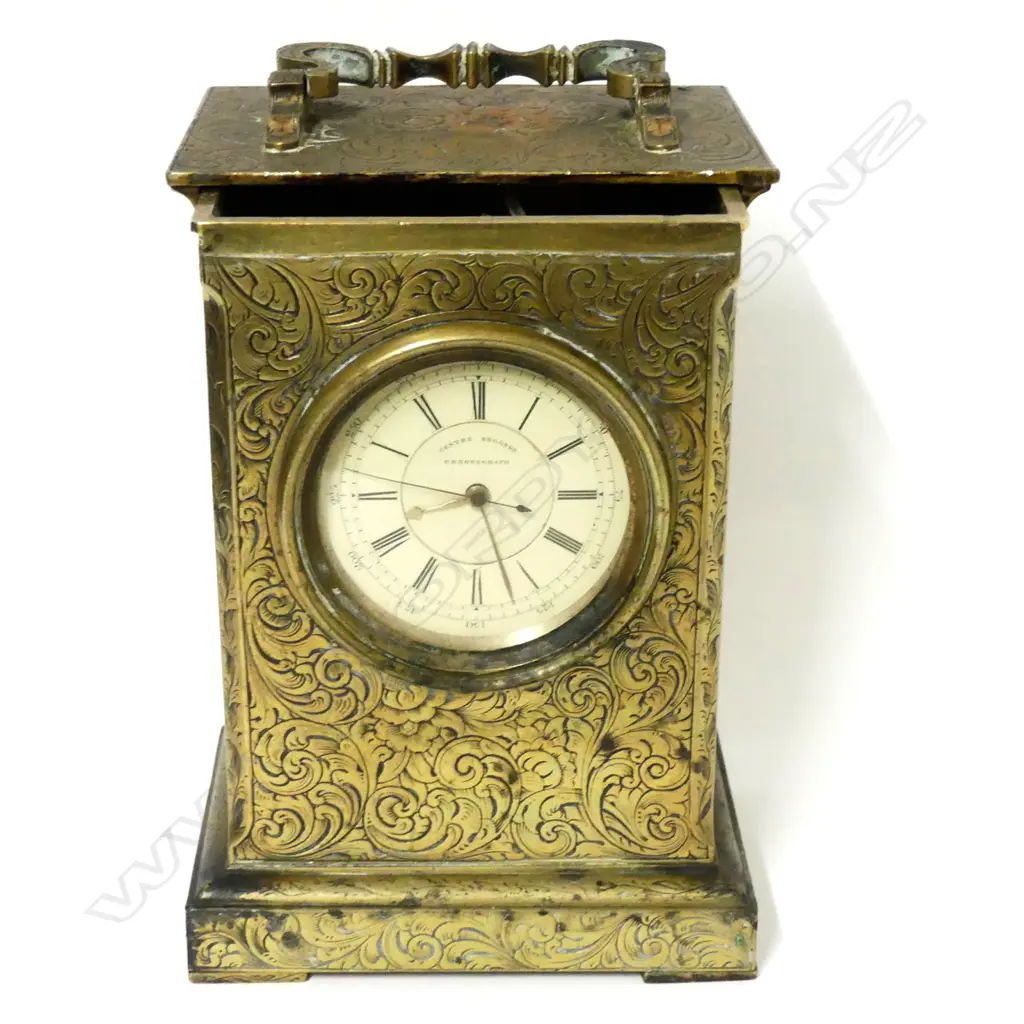 A brass pocket watch holder in the form of a carriage clock Image 1++