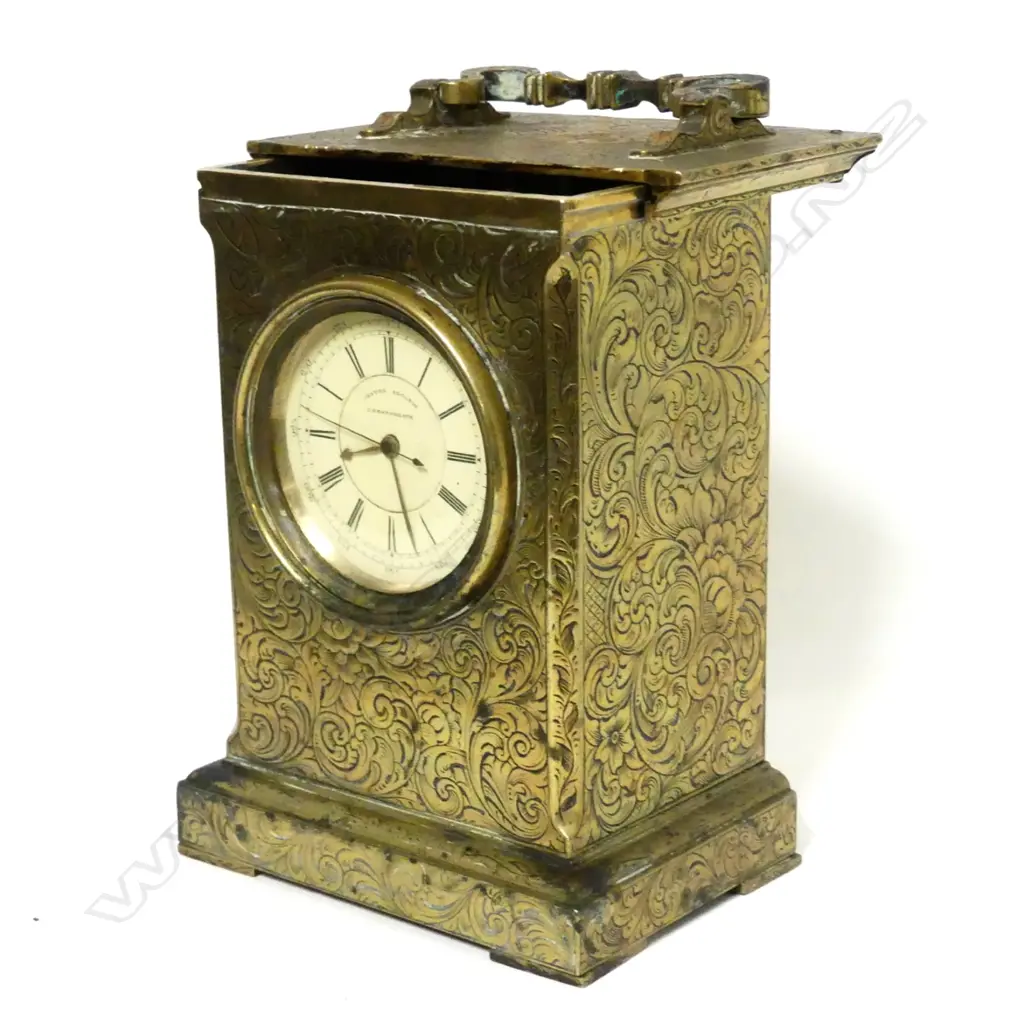 A brass pocket watch holder in the form of a carriage clock Image 1++