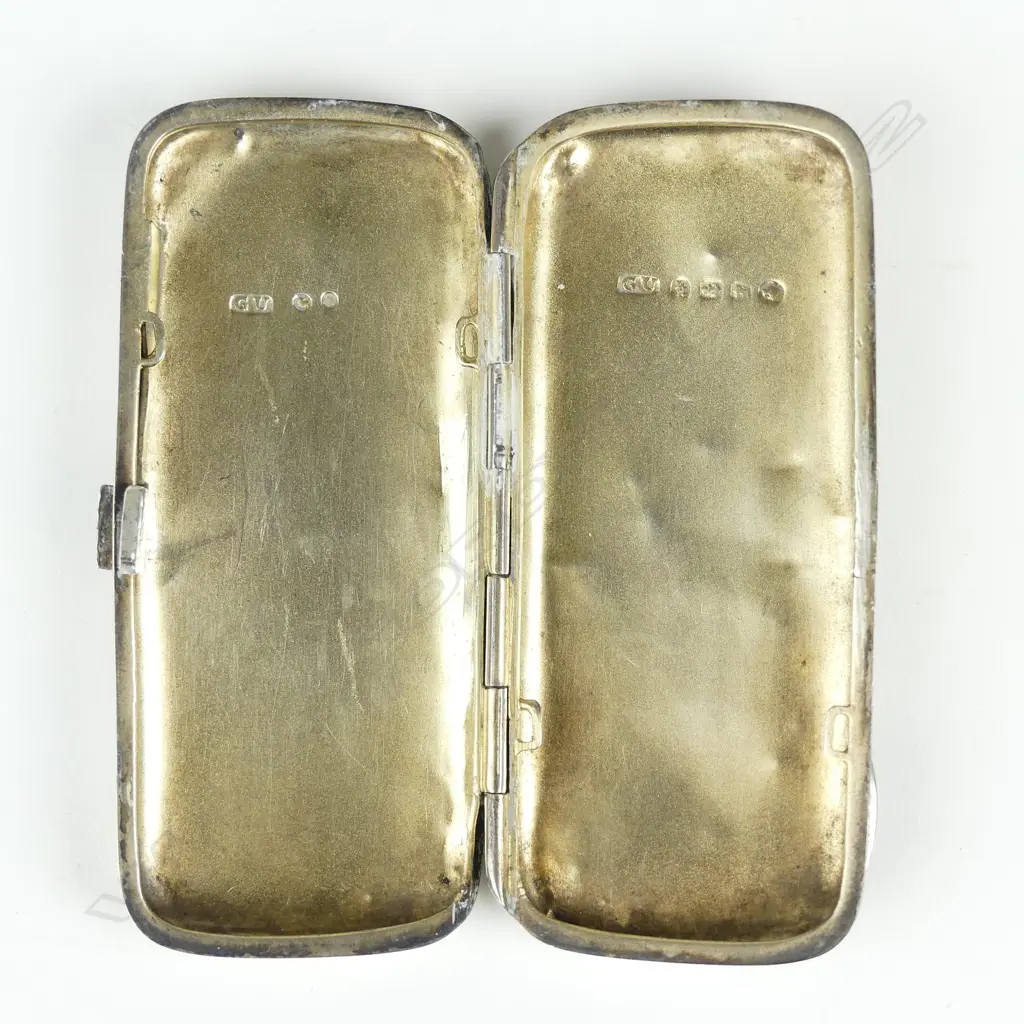 A silver cigarette case Image 1++