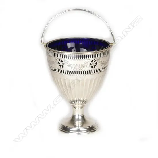 A silver pedestal sugar basket