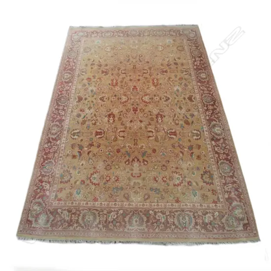 A large hand knotted Indo-Persian rug