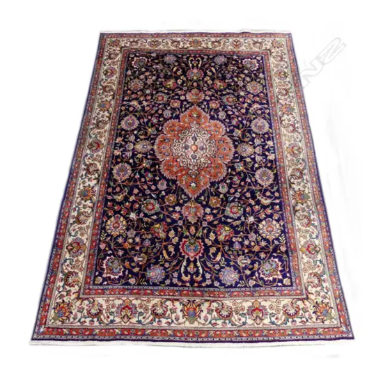 A large hand knotted Tabriz carpet