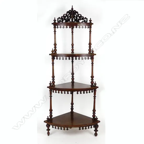 A Victorian figured walnut four tier whatnot