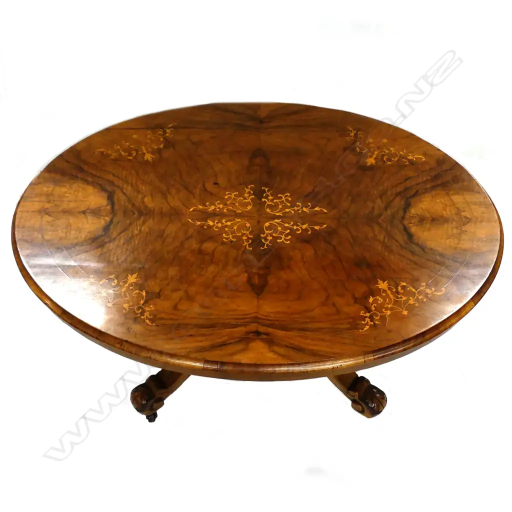 A Victorian small walnut occasional table Image 1++