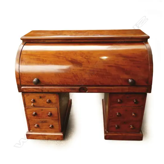 A large William IV flame mahogany cylinder desk