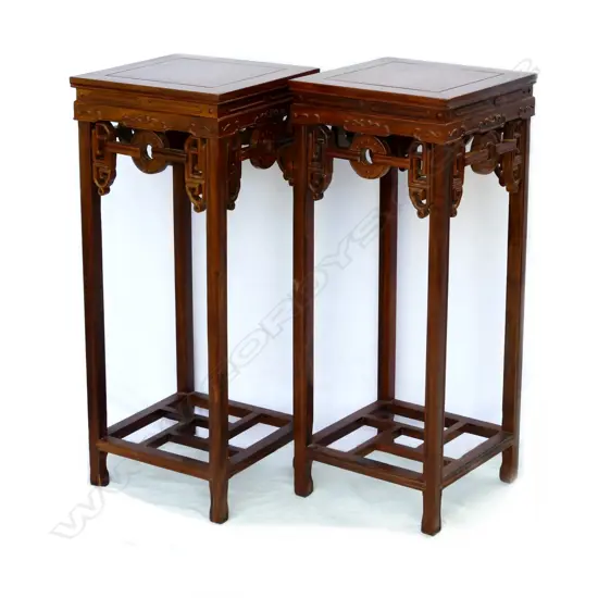 A pair of Chinese hardwood vase stands