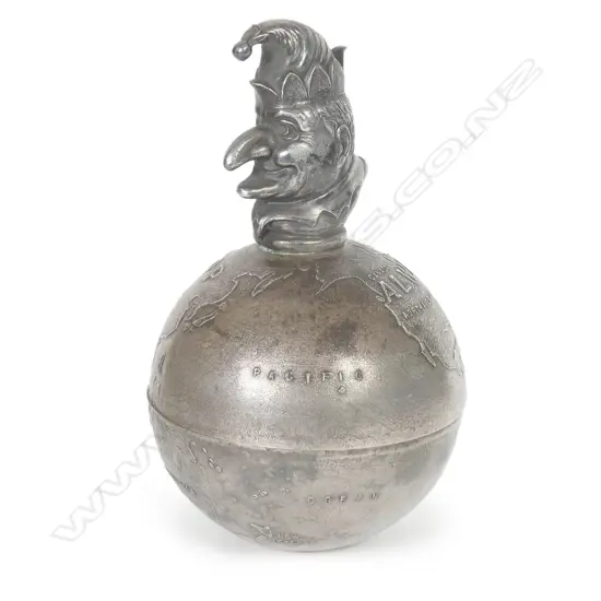 A vintage Mr Punch 'Always on Top' silver plate globe paperweight