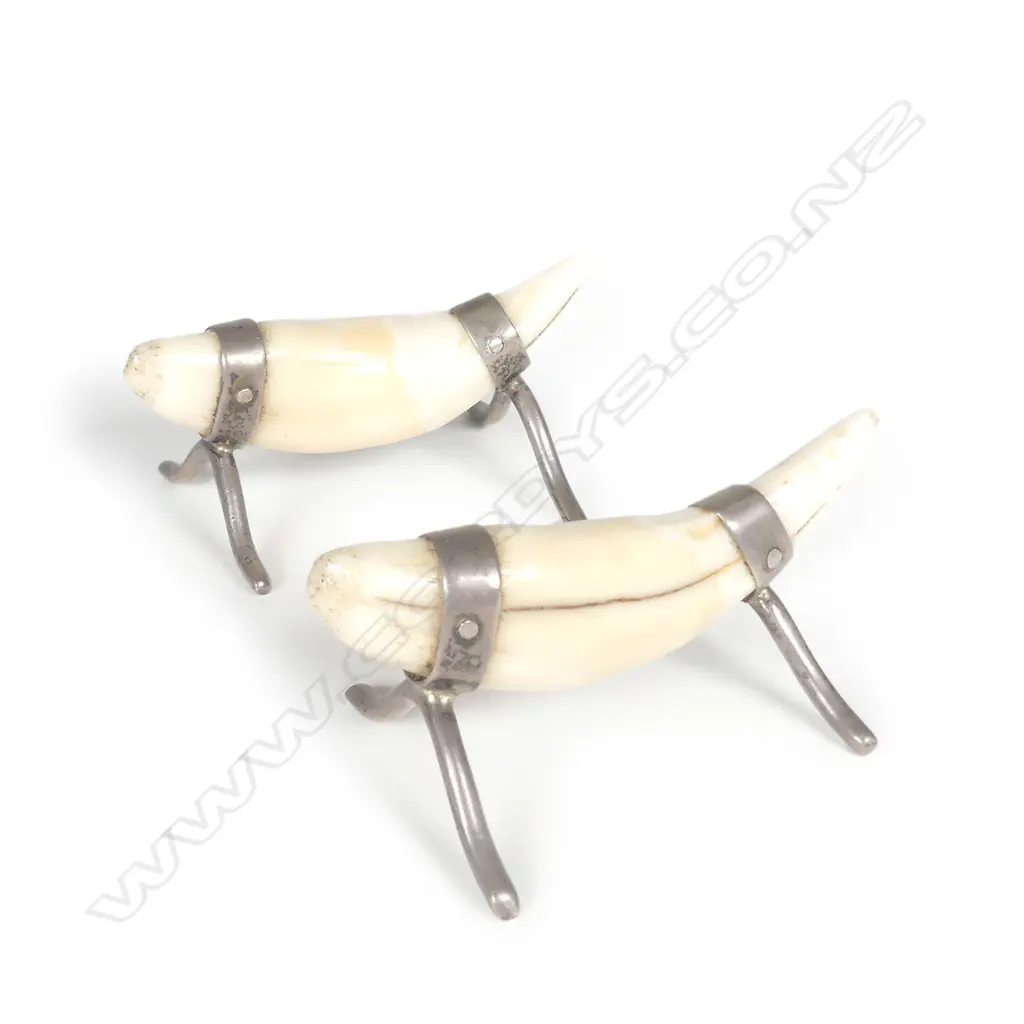 A pair of c.1900 leopard's teeth and silver mounted knife rests Image 1++