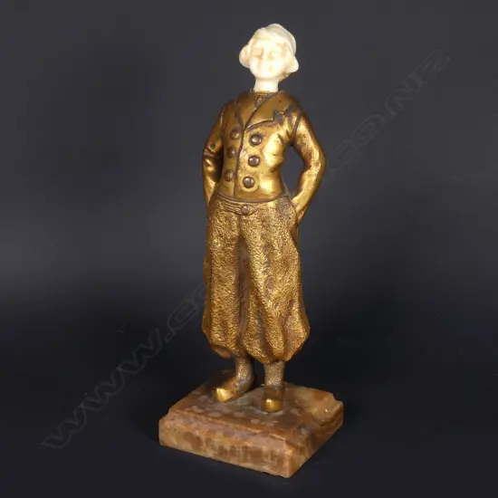 A gilt bronze and ivory figure of a Dutch boy