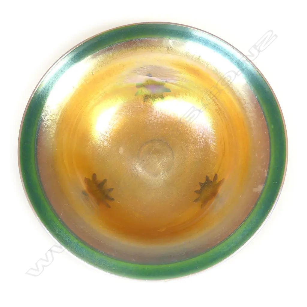 A Tiffany Favrile (green-gold) glass bowl raised on three scroll feet Image 1++