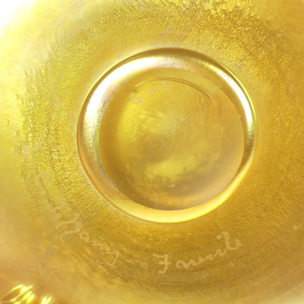 A Tiffany Favrile (green-gold) glass bowl raised on three scroll feet Image 1++