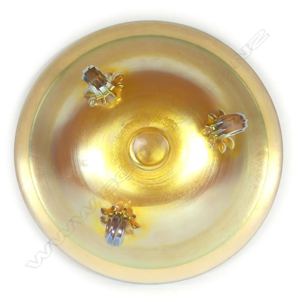A Tiffany Favrile (green-gold) glass bowl raised on three scroll feet Image 1++