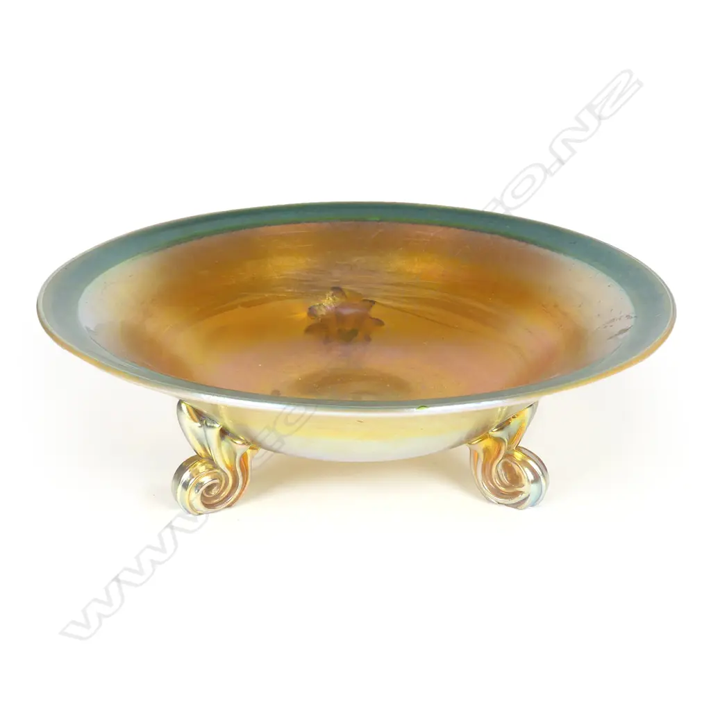 A Tiffany Favrile (green-gold) glass bowl raised on three scroll feet Image 1++