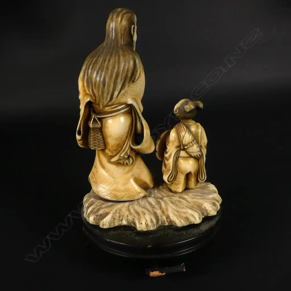 A 19thC Japanese ivory okimono of a sennin and acolyte Image 1++