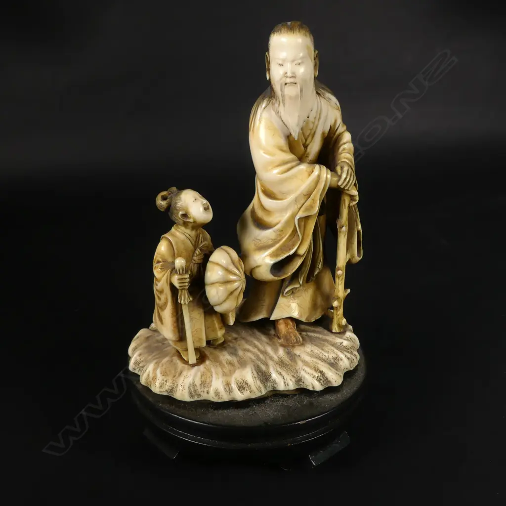 A 19thC Japanese ivory okimono of a sennin and acolyte Image 1++